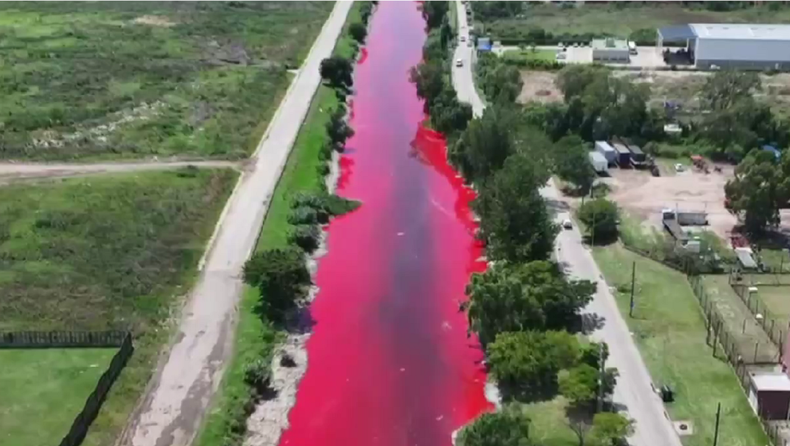 The Sarandí stream, dyed red.