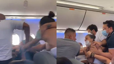 Brutal pelea a las trompadas y objetos volando por un asiento en el avión. Brutal pelea a las trompadas y objetos volando por un asiento en el avión.