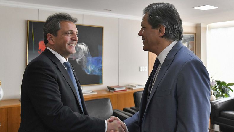 Massa junto a su par Haddad.