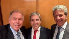 Pazo junto a Caputo y Werthein.