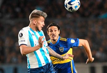 Ayrton Lucas of Flamengo heads the ball against Matias Rojas of