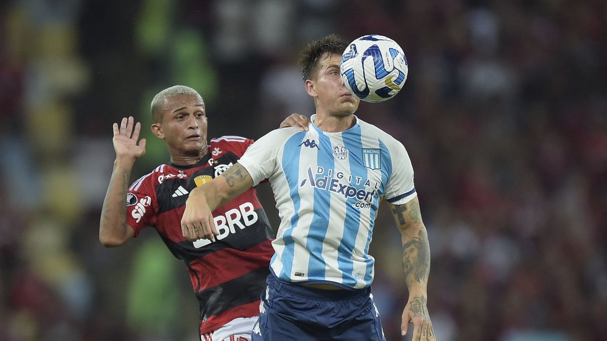 Ayrton Lucas of Flamengo heads the ball against Matias Rojas of